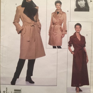 May include: Vogue Attitudes pattern 2026 featuring three coat designs. The main image shows a long, tan coat with a black faux fur collar, a belt, and pockets. Additional designs include a shorter tan coat and a long burgundy coat. The pattern size is 12-14-16.