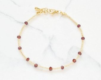 Red garnet and gold bracelet | Dainty beaded wristlet with maroon crystals | January birthstone gift