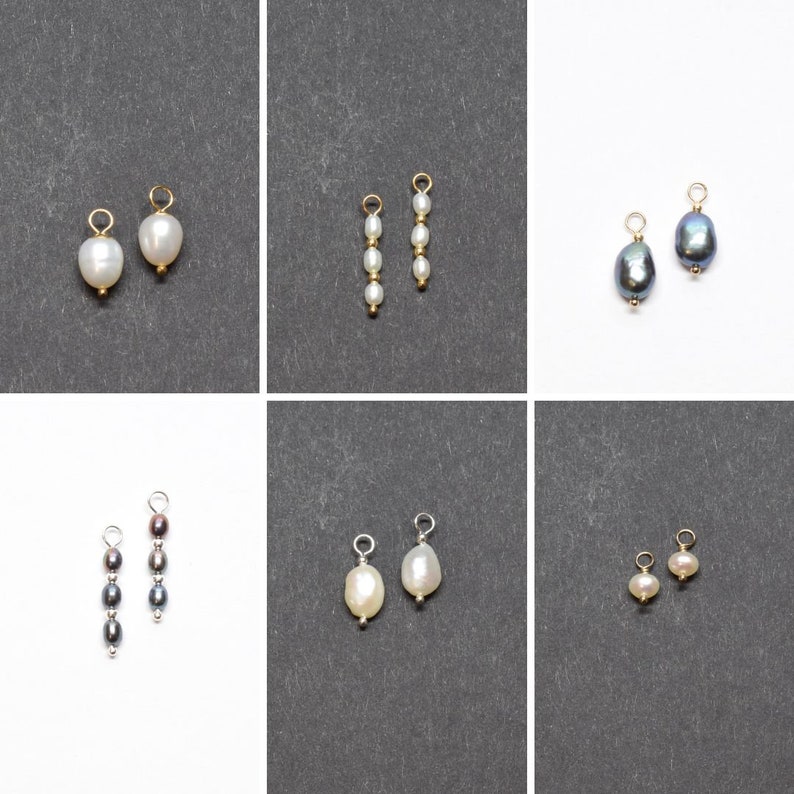 May include: Six pairs of pearl and black pearl earring charms with gold and silver findings. The charms are on a white and grey background.