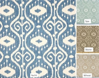 May include: A close-up of a blue and white patterned fabric with a repeating geometric design. The fabric is labeled "Yacht". Three other fabric swatches are shown in the image, labeled "Spa", "Stone", and "Wheat".