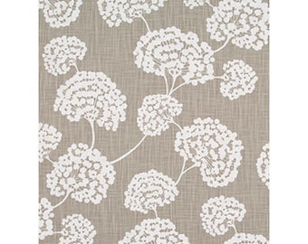 May include: A beige fabric with a white floral pattern. The flowers are stylized and resemble small clusters of dots.