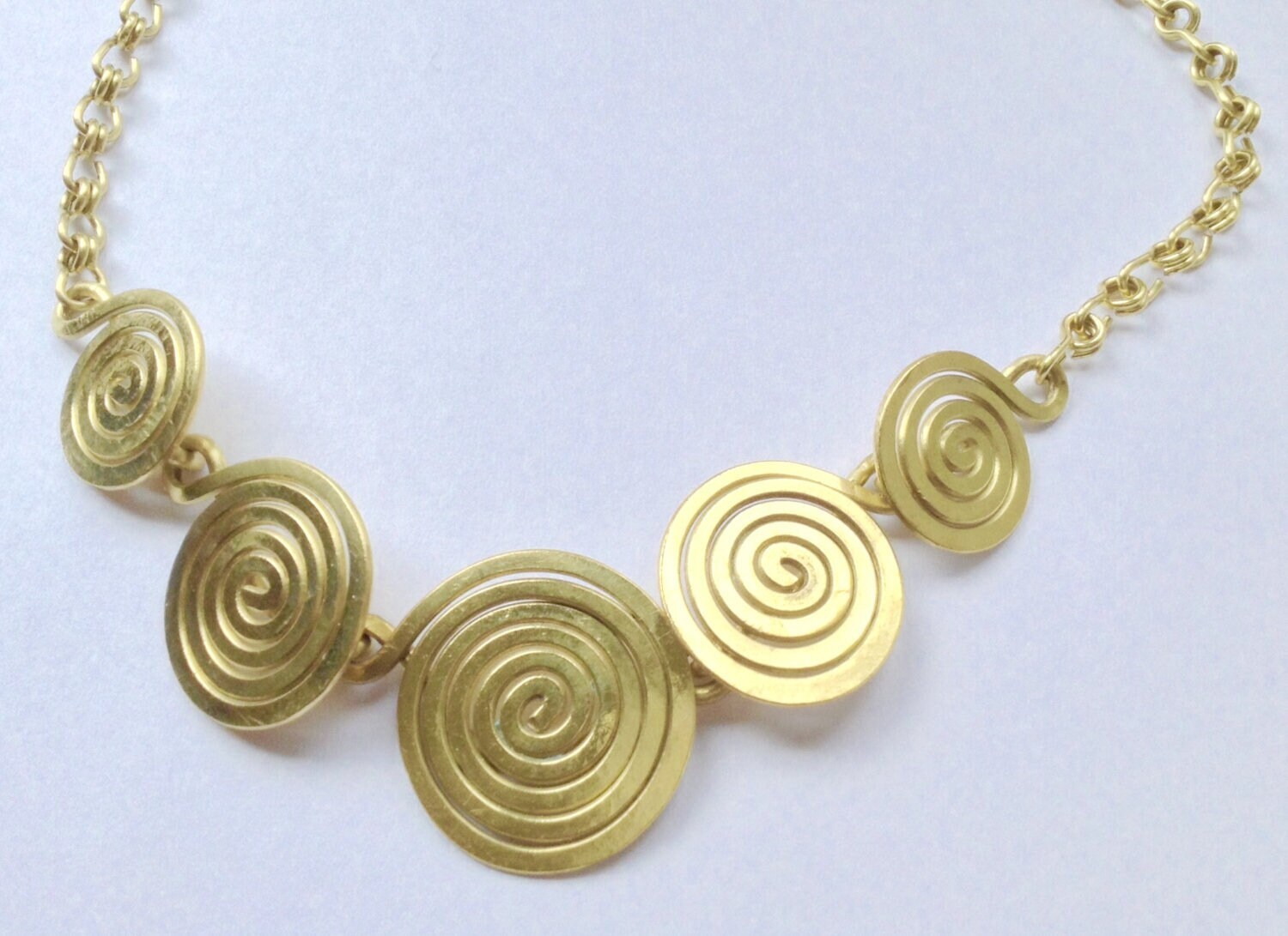 Spiral necklace in brass 5 spirals infinity