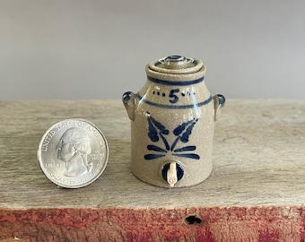Miniature wheel thrown stoneware water cooler in gray clay with cobalt floral decoration with tiny carved wood tap, lid is removable
