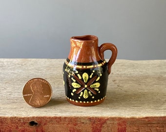 Miniature, traditional Redware Earthenware pitcher with primitive slip and sgraffito decoration