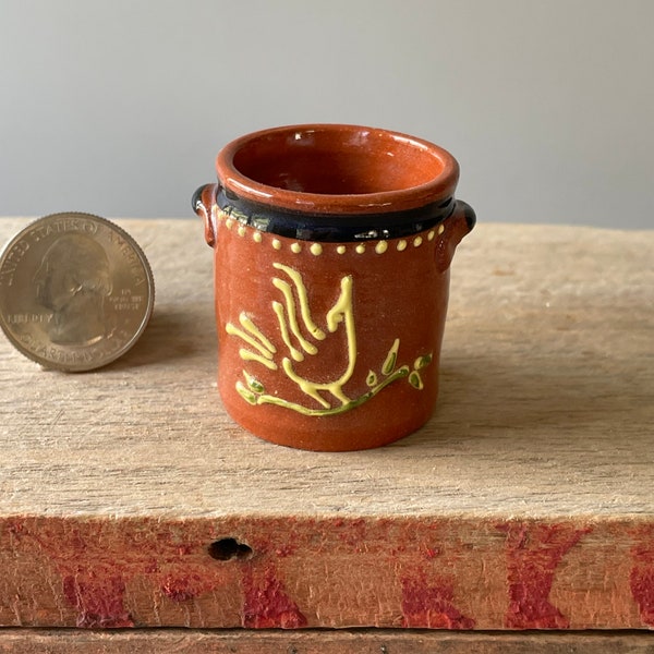 Miniature, traditional Redware Earthenware crock jug with primitive slip bird of paradise decoration