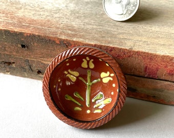 Miniature, traditional Redware Earthenware bowl with slip trailed tulip decoration, sponge painting and traditional coggled (roulette) edge