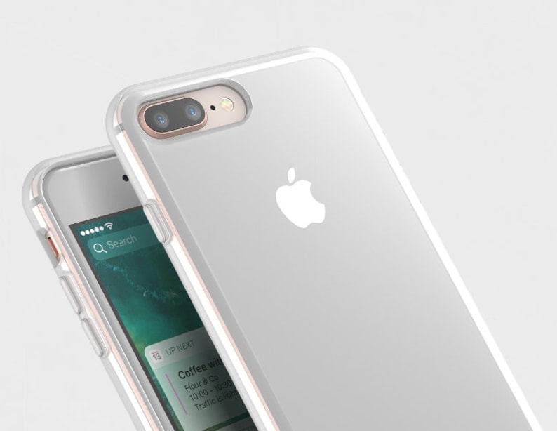 Puede incluir: Una funda para iPhone blanca con la parte posterior transparente y un logotipo de Apple blanco. La funda est&aacute; hecha de un material flexible y tiene un borde elevado alrededor del objetivo de la c&aacute;mara para protegerlo de los ara&ntilde;azos.