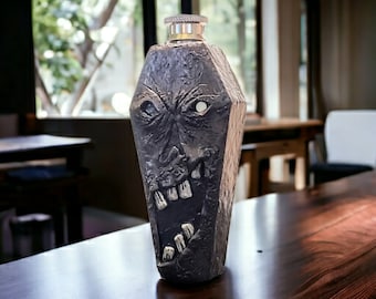 Necronomicon Coffin Flask - 3.5oz flask with glow in the dark eye