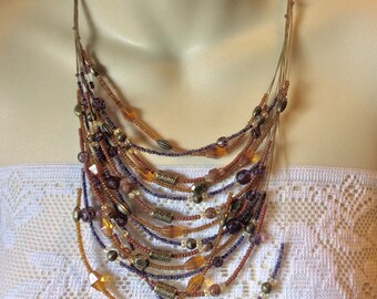 Coldwater Creek 14 strand glass and metal beads necklace .