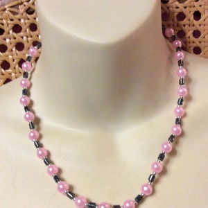Pink imitation acrylic pearls with hematite beads necklace .