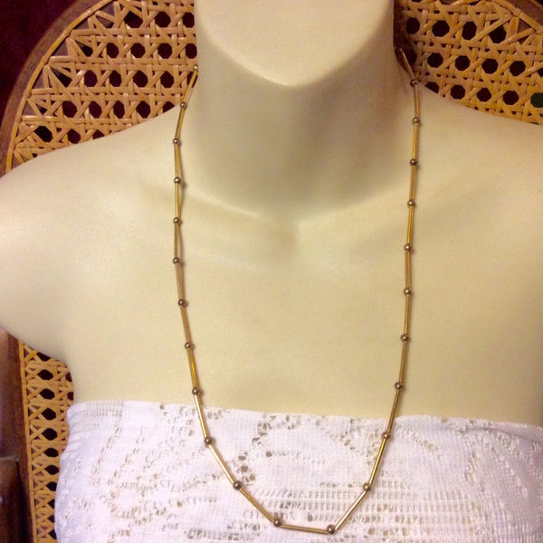 Vintage Les Bernard gold metal tube chain and metal beads necklace. 1960s