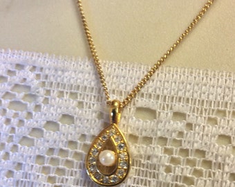 Vintage teardrop shaped rhinestone pearl pendant necklace .