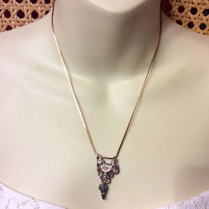 Mexican sterling 10k gold saddle pendant necklace.