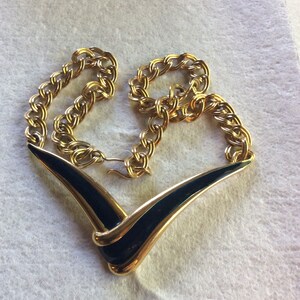 Vintage Monet navy blue enamel on metal v pendant necklace .