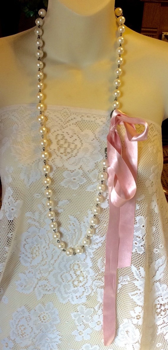 Pearl necklace with pink ribbon tie signed Seasons