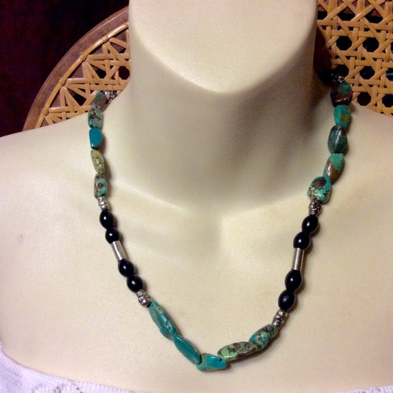 Genuine turquoise and skull beads necklace.