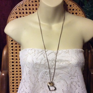 Vintage silver heart pendant with silver wire wrap necklace.