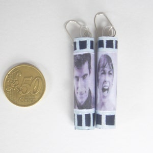 Earrings in black cardstock decorated with white acrylic shaped film (Psycho by Alfred Hitchcock)