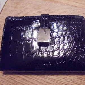 Cartera de piel negra patentada de Crroft & Barrow