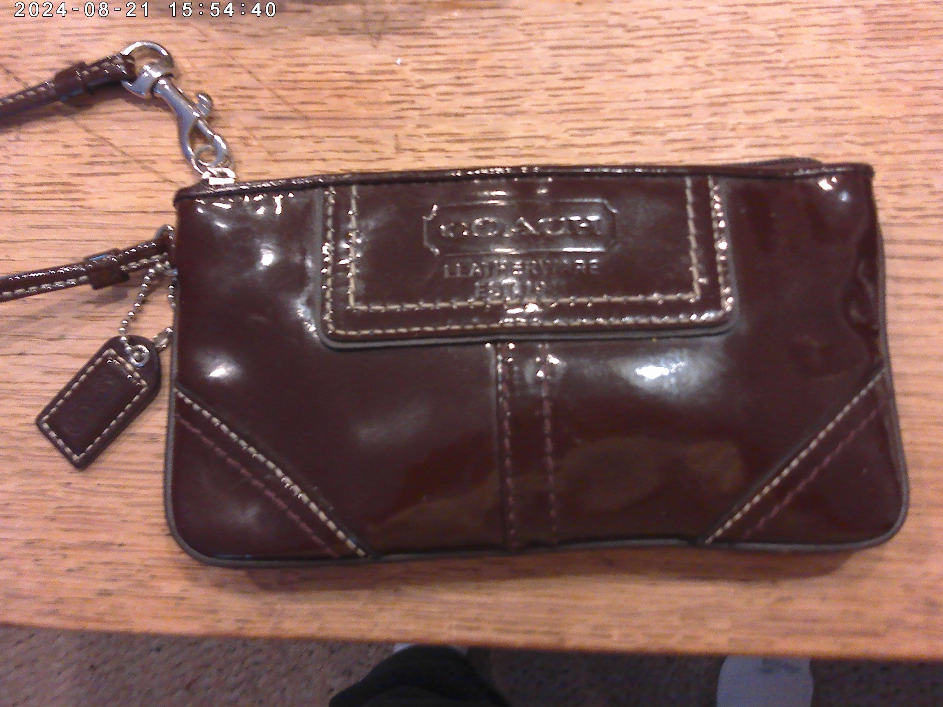 Bolso de mano Coach de piel charol marrón