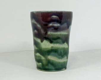 ceramic pint glass in green and purple with light blue lines