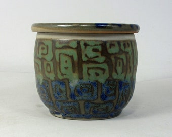 French butter dish in green with blue and mossy green concentric squares