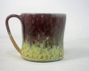 coffee cup in red and yellow with polka dots