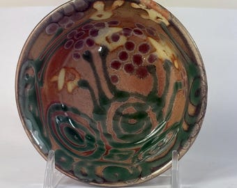 tiny bowl in Shino with yellow and red flowers