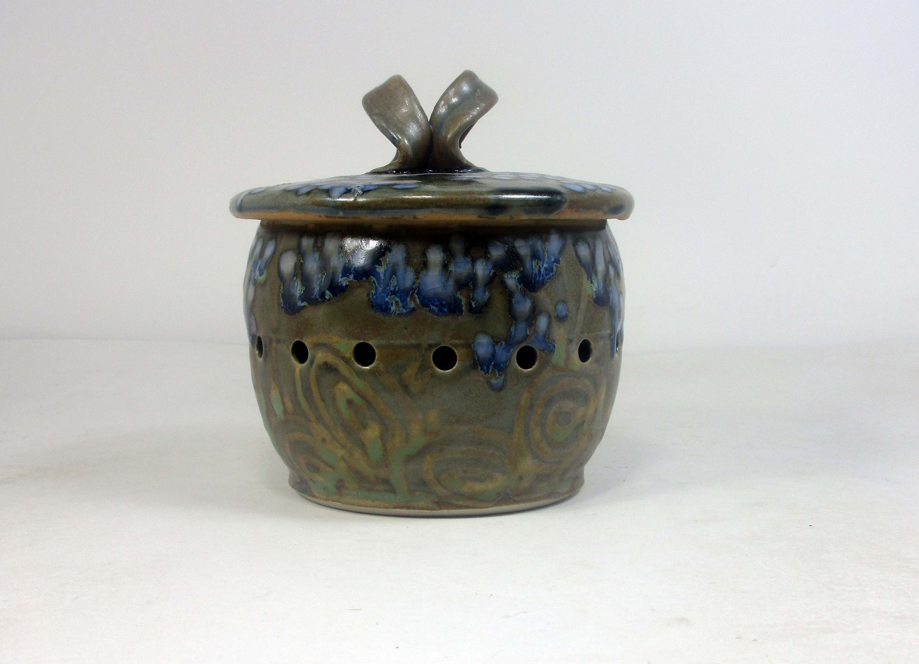 Garlic jar and roaster in dark green with blue flowers