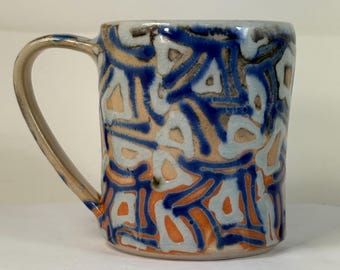 small cup in Shino with light blue squares and blue lines