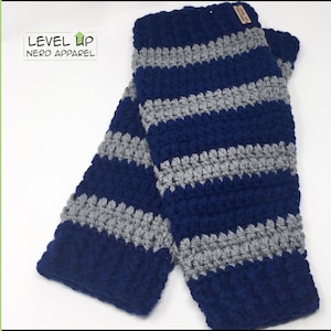 May include: A pair of blue and gray striped leg warmers with a brown tag that says "Level Up Nerd Apparel".