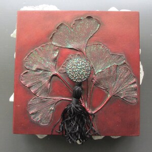 Grace, a square wooden box