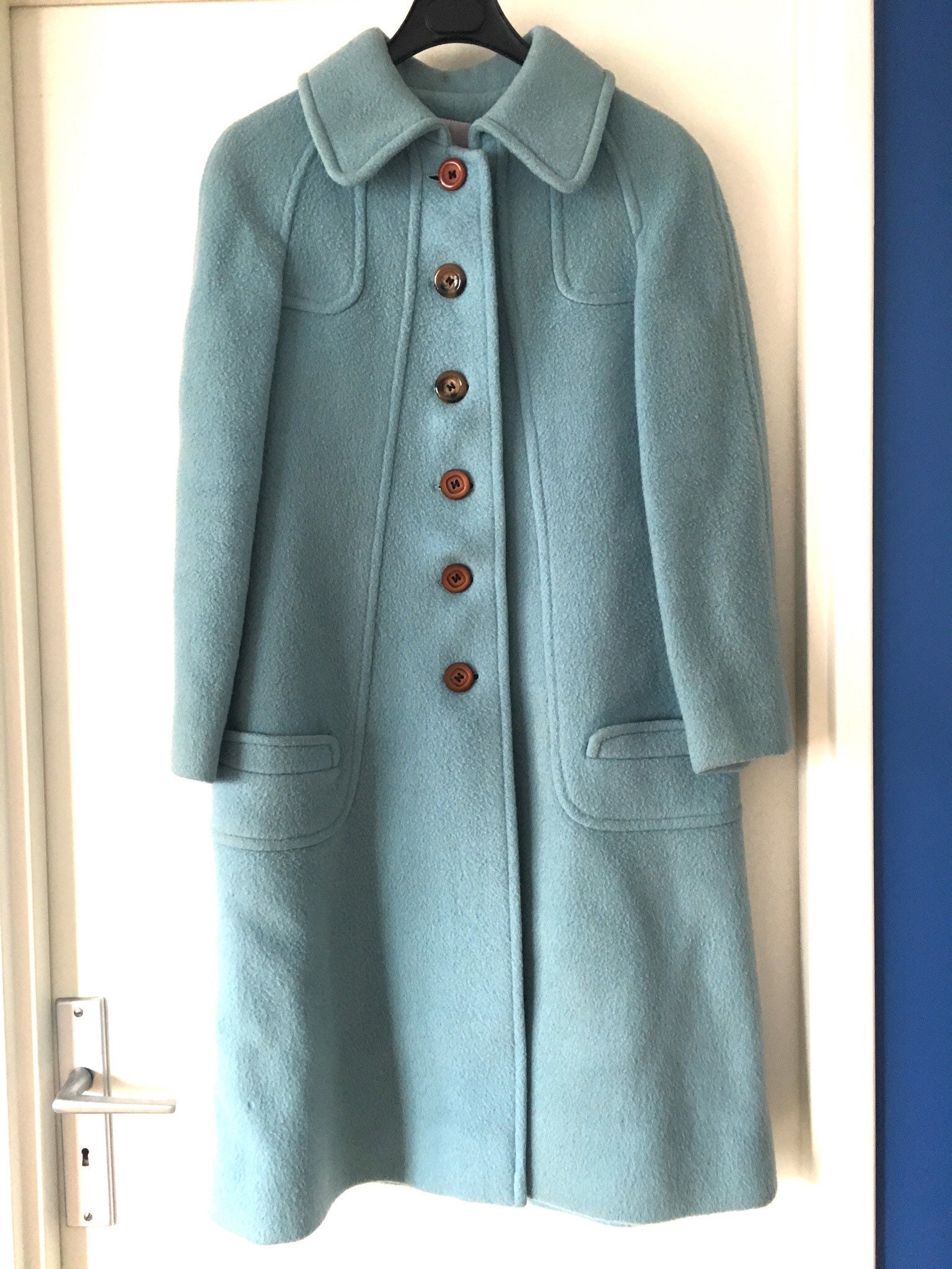 light blue coat