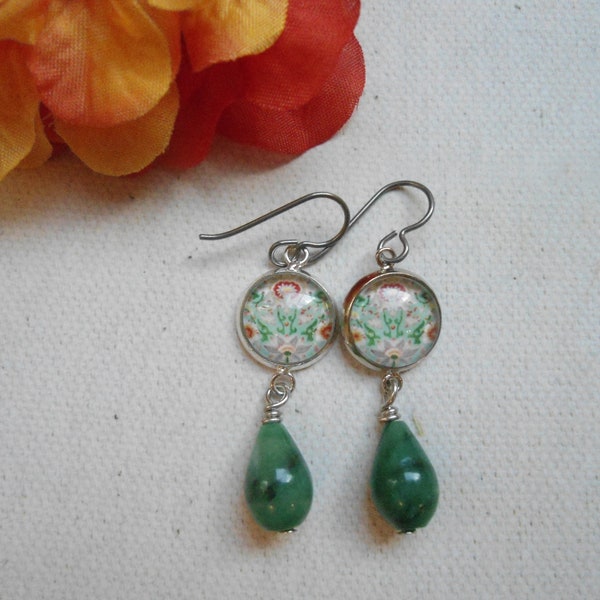 Antique style green and orange colored glass cabochon glued onto silver plated connectors and hooked onto Vintaj Niobium earring hooks