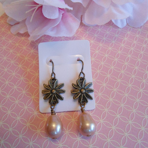 Pink daisy earrings:  Antique brass salmon pink daisy flower earrings with Vintaj brand earring hooks and head pins