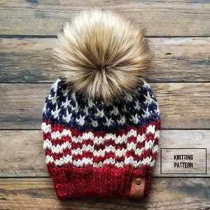 May include: Knitting pattern for a red, white, and blue beanie with a faux fur pom pom. The beanie features a design resembling the American flag.