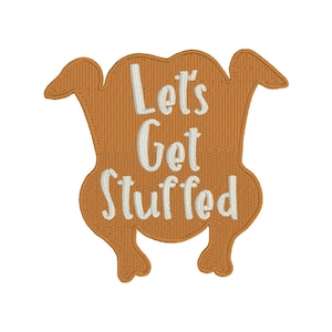 Puede incluir: Un parche bordado marrón con forma de pavo con el texto "Let's Get Stuffed" en blanco.