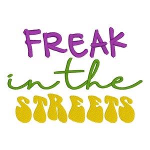 May include: Purple, green and yellow embroidered text that reads "Freak in the Streets".