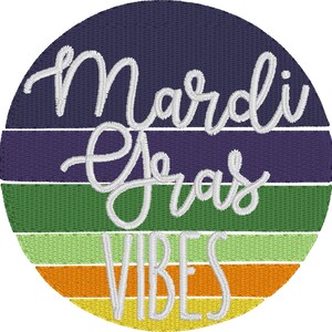 May include: A circular design with a colorful striped background in shades of purple, green, yellow, and orange. The text "Mardi Gras Vibes" is written in white cursive font.