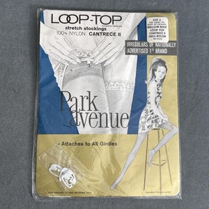 May include: Vintage package of Loop-Top stretch stockings in Mellow Beige. The package features the text "Park Avenue" and an illustration of a woman wearing a dress. The package also includes the text "Attaches to All Girdles".