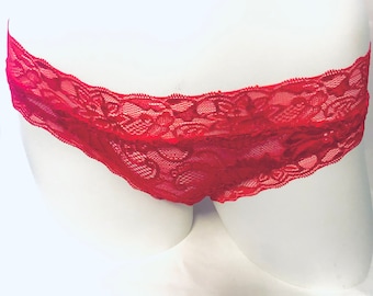 May include: Red lace underwear with a floral pattern.