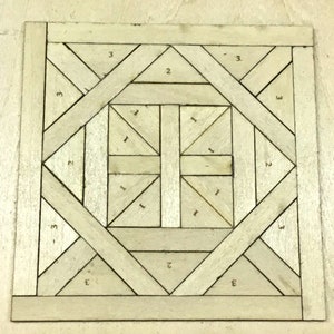 May include: A square, light-colored wooden puzzle with a geometric design. The puzzle is composed of various shapes, including triangles and rectangles, arranged in a symmetrical pattern. Numbers 1, 2, and 3 are visible on some of the pieces.