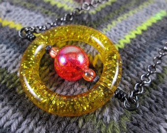 Saturn Spinner Pendant Necklace - Gold Orange Red Glitter - Long Chain