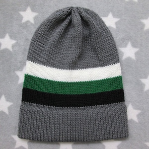 May include: Gray knitted beanie with white, green, and black stripes.