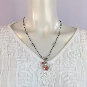 Juliana Milagro Bead and Crystal Necklace.  Miracle charms and  adorn this artisan-made necklace. Made in Mexico