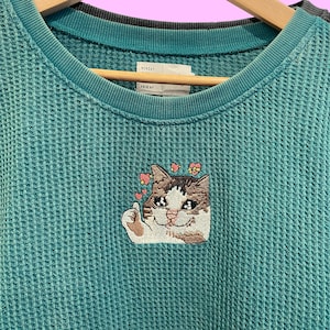 Thumbs up crying cat meme embroidered waffle sweater. Funny cat meme sweater