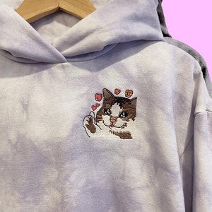 Thumbs up crying cat meme embroidered tie dye hoodie. Funny cat meme hoodie