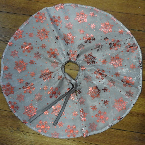 Red and Silver Christmas Tree Skirt with red snow flakes.