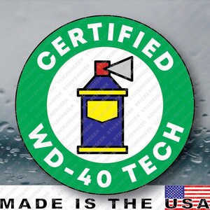 May include: A circular sticker with a green border and white background featuring the text CERTIFIED WD-40 TECH in bold white letters. In the center is a graphic of a blue spray can with a yellow label, a red nozzle, and a gray spray cone.