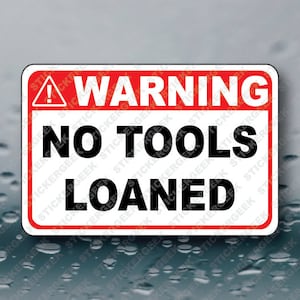 May include: A red and white warning sign with an exclamation point and the text "WARNING NO TOOLS LOANED".